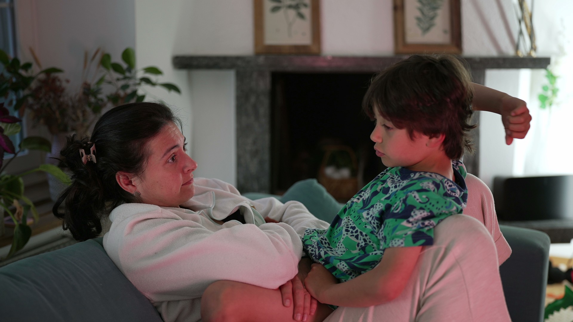 Mother having a calm conversation with her child about head lice